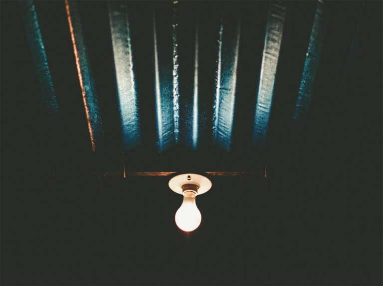 lightbulb glowing in the dark