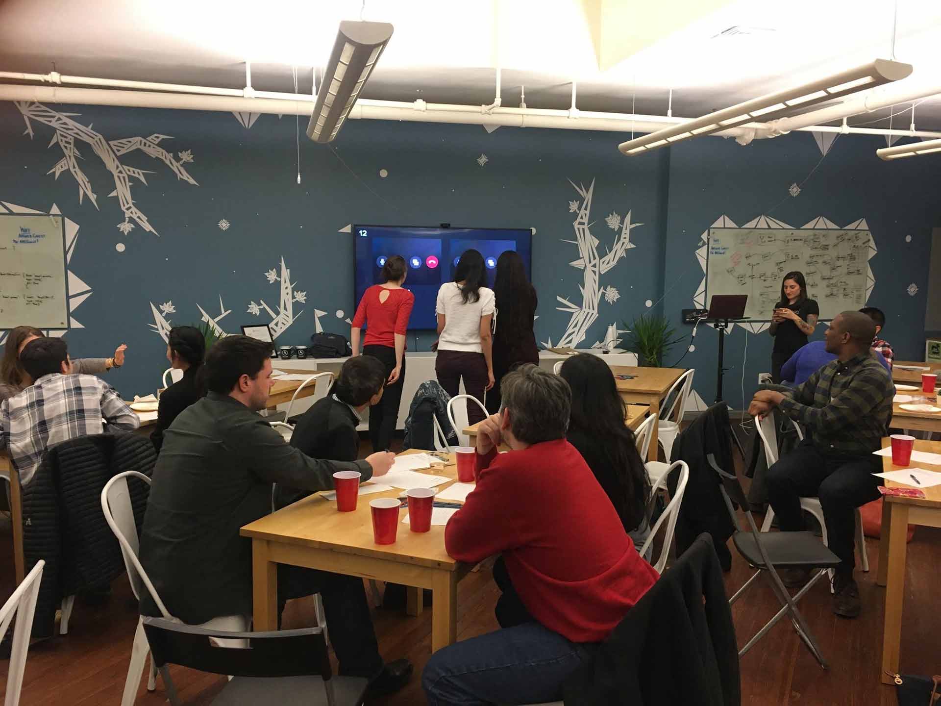 Picture from GameOnUX Night of attendees playing UX game.